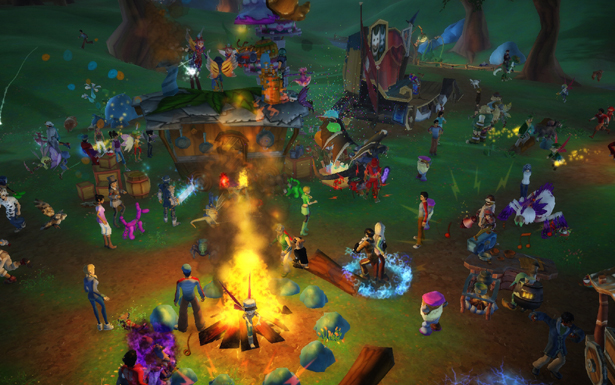A large gathering of Free Realms players around a woodland campfire