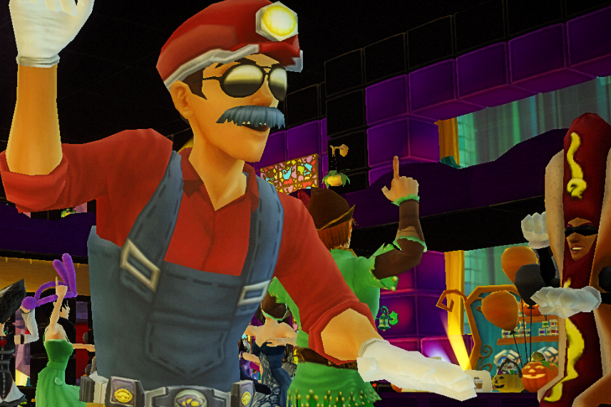 Costumed players celebrate together at a colorful indoor party